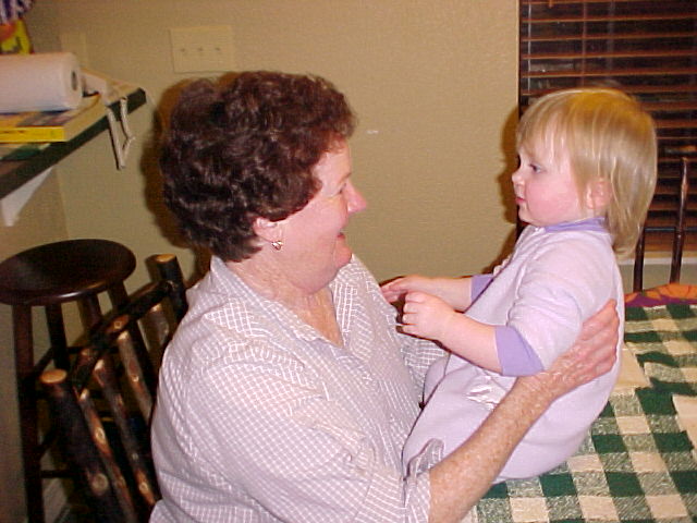 Lee Lenore holding her grandchild